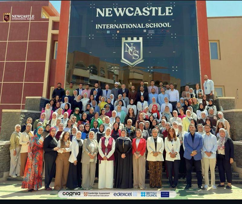 The Newcastle International School cohort on the school steps.